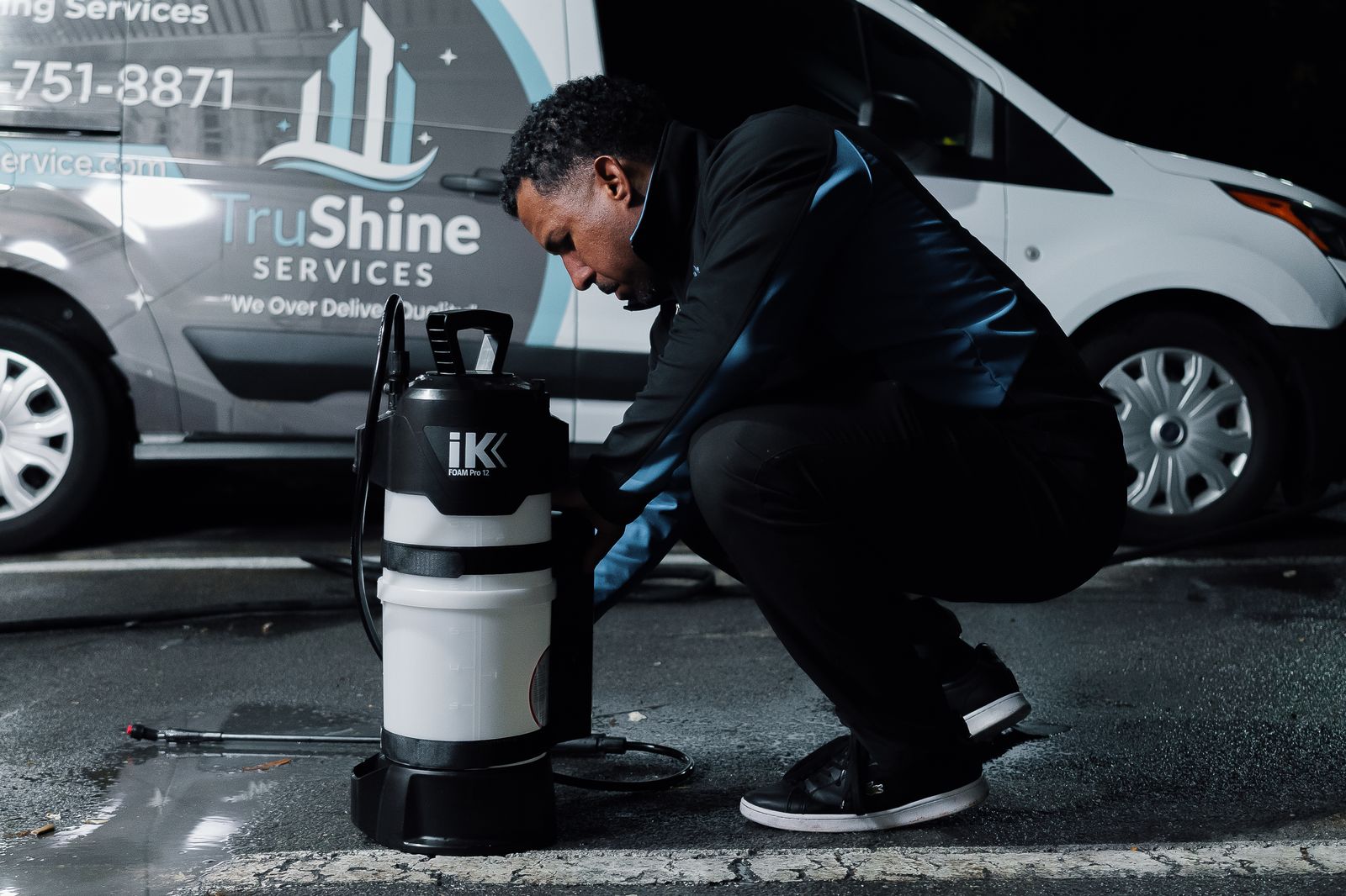 TruShine crew preparing equipment next to branded van before commercial hood cleaning service